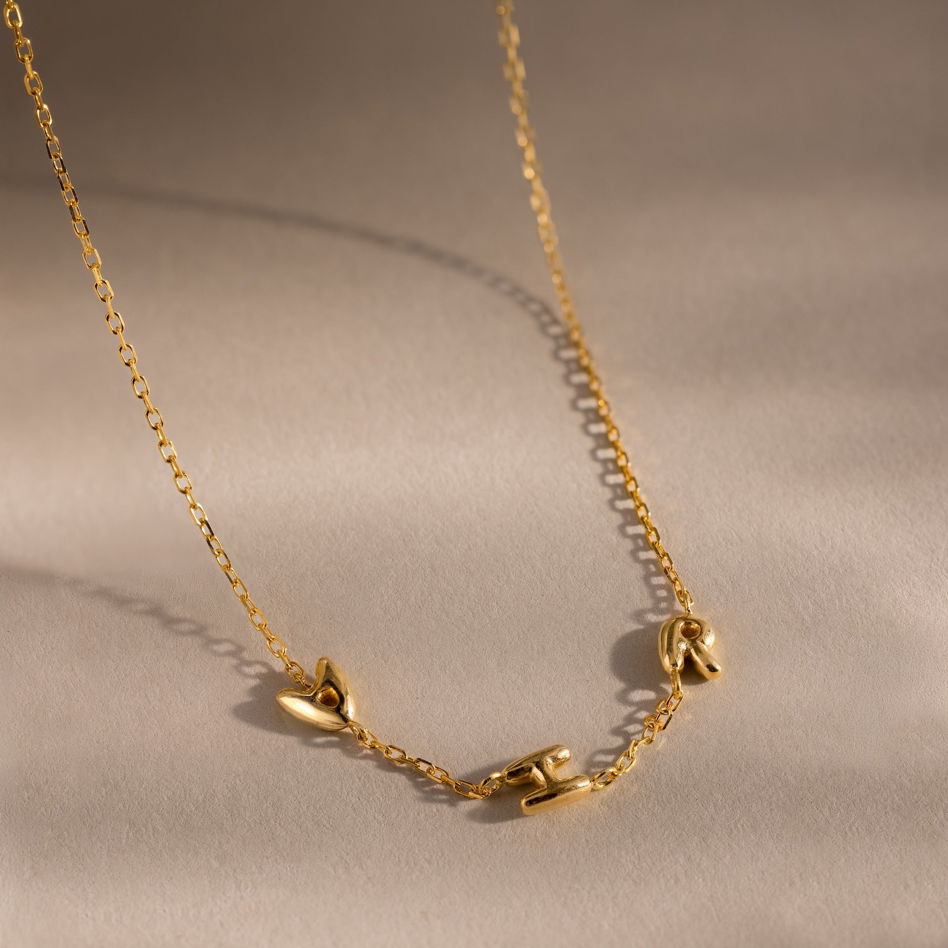 Collier à lettres multiples à bulles