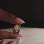 Model showcasing 3 gold Marquise Ombre Rings with gradient marquise-cut stones in green, red, and blue stone color variants.