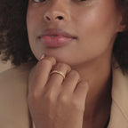Model showcasing gold filigree ring on hand with close-up and movement.
