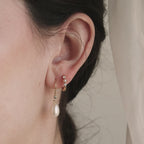 Boucles d'oreilles pendantes en perles et diamants