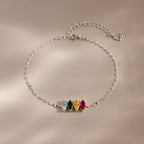 The Multiple Marquise Birthstone Bracelet in Sterling Silver features four colored gemstones and an adjustable chain, beautifully displayed on a neutral background. Perfect customizable jewelry for lovers of elegant birthstone bracelets.