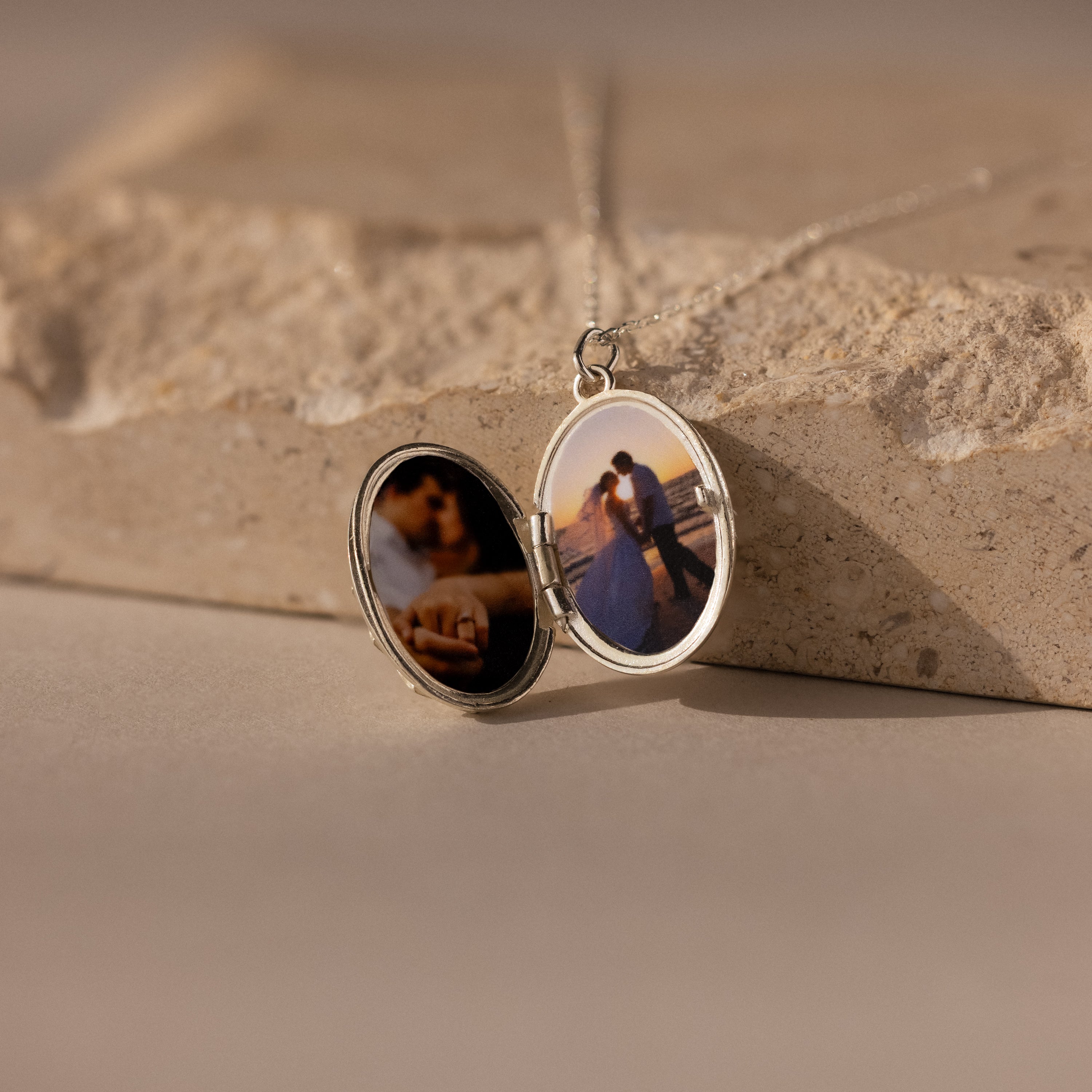 The Floral Handwriting Locket Necklace in Sterling Silver opens to reveal two romantic photos inside, letting you keep cherished memories and loved ones close to your heart.