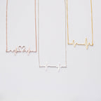 The Heartbeat Necklace features three pendants—one heart-shaped, one plain, and one gold—making it a unique piece of voice jewelry and a thoughtful personalized gift.