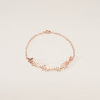 The Classic Multiple Name Bracelet features a dainty chain with the names Layla, Sydney, and Rowan in elegant cursive—perfect personalized jewelry for any occasion.