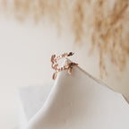 The Grace Duo Name Ring, personalized with "Rowena" and "Jordyn" in elegant cursive, is shown on a white surface.