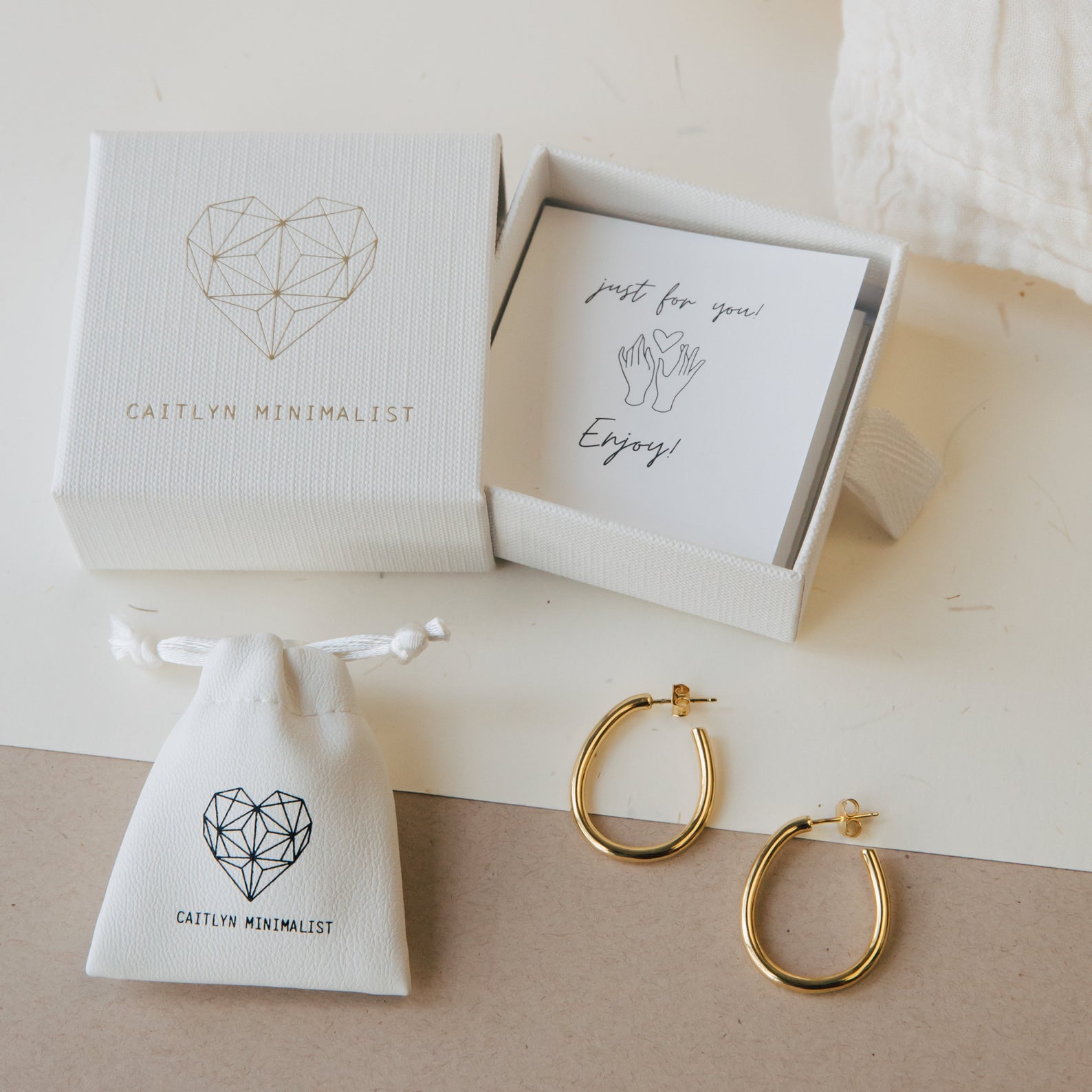 The Alannah Ring comes with a white drawstring pouch and a gift box labeled Caitlyn Minimalist—an elegant jewelry piece perfect for gifting.