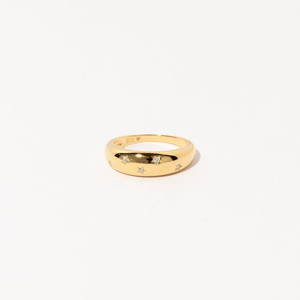 The Star Dome Ring showcases star-shaped engravings and diamond-encrusted stones, making it an eye-catching choice for a bold ring stack, beautifully presented against a plain white background.