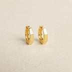 The Audrey Huggies are a stylish pair of gold earrings, perfect for everyday wear.