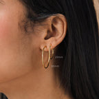 Close-up of an ear wearing Thin Hoop Earrings in 20mm and 30mm sizes—perfect simple hoops for everyday jewelry style.