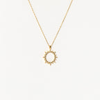 The Pave Sun Necklace features a sun-shaped pendant with pointed rays and subtle pave accents, shown against a plain white background.