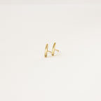 Dainty Bar Studs: these minimalist earrings are perfect for an effortless earring stack, shown on a plain light background.