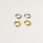 Two pairs of Dainty Sphere Beaded Huggies—one in silver, one in gold—are displayed on a light beige background.