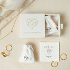 The Madison Hoops are classic gold earrings, elegantly packaged in branded pouches within a Caitlyn Minimalist gift box.