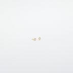 Avery Geometric Diamond Studs: Small gold diamond-shaped studs with tiny clear pavé stones, shown against a plain white background.