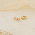 Glacier Baguette Huggies are gold earrings featuring a minimalistic design and dazzling diamonds for subtle sparkle.