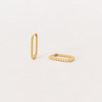 The Indiana Beaded Hoops, a pair of chic gold earrings, are displayed on a plain, light background.