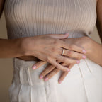 Evermore Diamond Band in 18K gold with pave diamond detailing on a woman's finger.