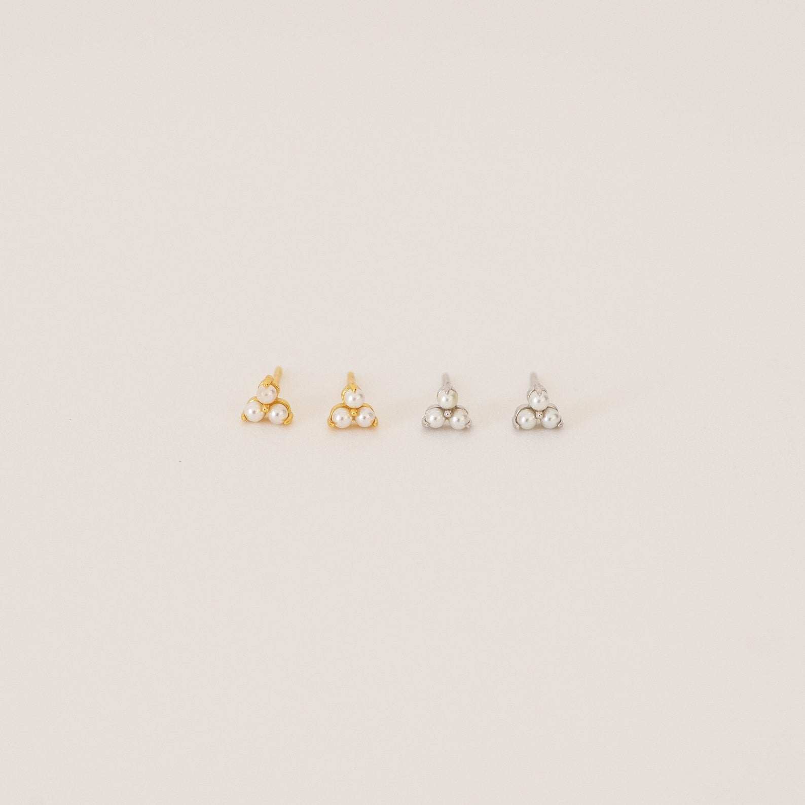 The Maud Pearl Studs feature elegant pearls and small stones, making them a timeless gift and a luxurious jewelry accent for any occasion.