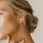 A close-up of a woman’s face showcases the elegant Odessa Marquise Studs—an ideal, thoughtful bridal gift.