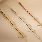 The Morse Code Necklace comes in gold, silver, and rose gold, with personalized messages like Breathe, Hailey, and Paige—a perfect gift to cherish daily.