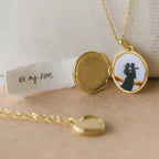 The Endless Love Locket Necklaces feature a gold photo locket with a couple hugging beside a note that reads “all my love” on torn paper—a heartfelt keepsake jewelry piece.