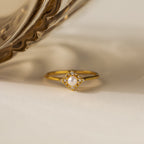 The Vintage Pave Pearl Ring in 18K Gold showcases a central pearl with pavé diamonds in a square setting on a reflective gold band—an elegant and exquisite Christmas gift choice.