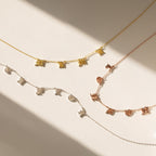 The Old English Letter Name Necklace, available in gold, silver, and rose gold finishes, is displayed on a light background—perfect for lovers of minimalist jewelry with a personalized touch.