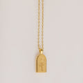 The Birth Flower Arch Necklace features a rectangular pendant with a rose engraving, displayed on a simple background—a beautiful personalized jewelry piece to enhance any outfit.