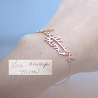 The Handwriting Bracelet in rose gold features "Love Always Mom" in cursive on the wrist, with a matching handwritten note—meaningful memorial jewelry for everyday wear.