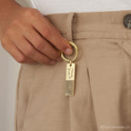 A hand holds the Fingerprint Bar Keychain, a personalized keepsake with a custom fingerprint and "Forever with you" engraved on its rectangular tag.