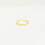 The Beaded Ring features a simple gold beaded design with a textured finish, ideal for stacking. Shown against a plain white background.