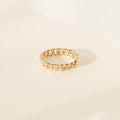 The Curb Chain Ring is shown on a light-colored surface with soft shadows, making it the perfect goth glam jewelry piece to elevate your style.