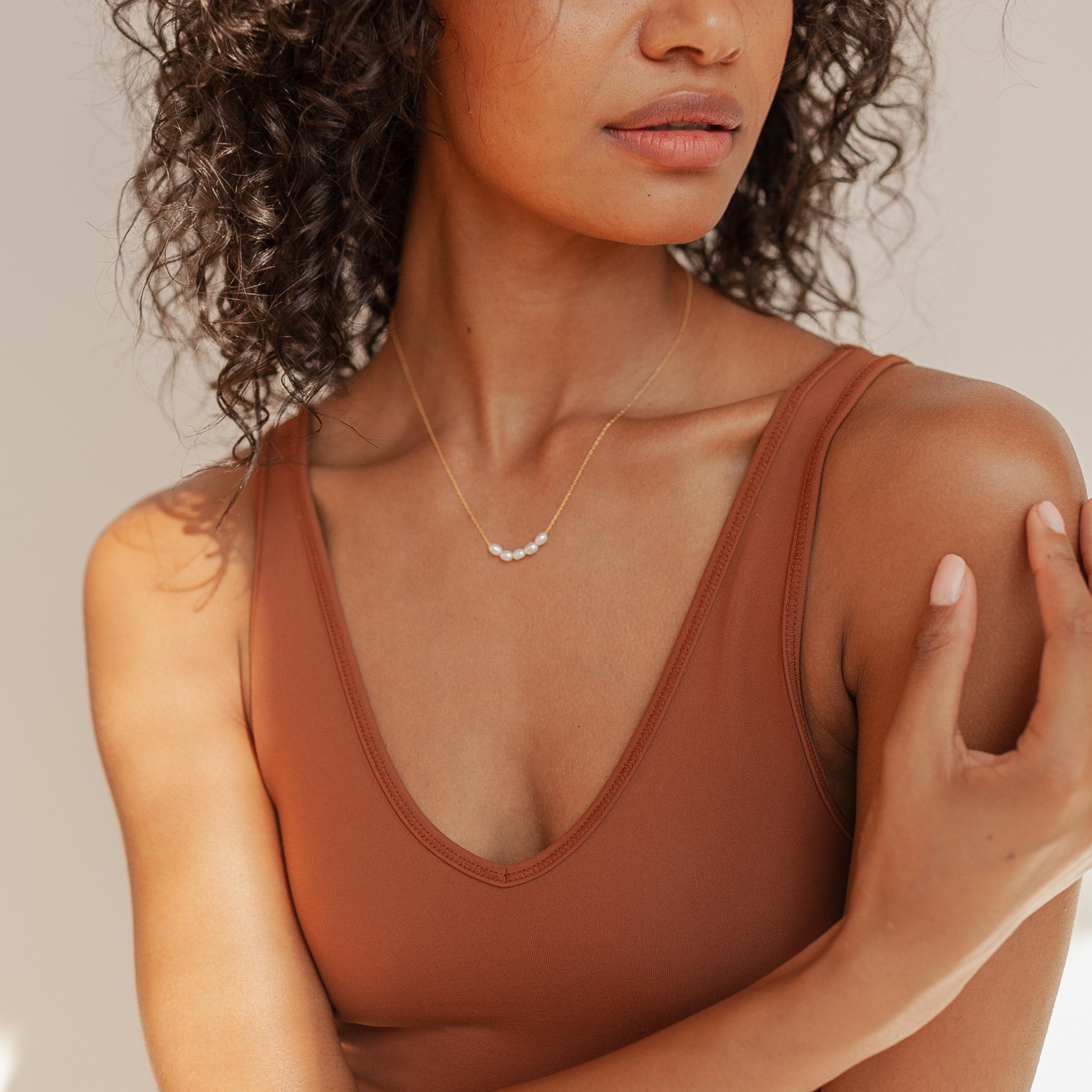 Model is wearing Gold Pearl Bead Necklace