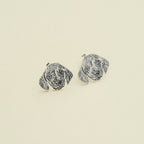 The Pet Portrait Studs are dog face-shaped earrings shown on a plain background—ideal custom pet jewelry for any animal lover and a charming addition to your collection.
