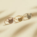 The Pet Portrait Ring features three cat-shaped designs in rose gold, gold, and silver on a neutral background—perfect custom jewelry for cat lovers seeking a unique pet-themed ring.